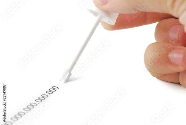 Obraz Erasing zeros with correction fluid on white background.