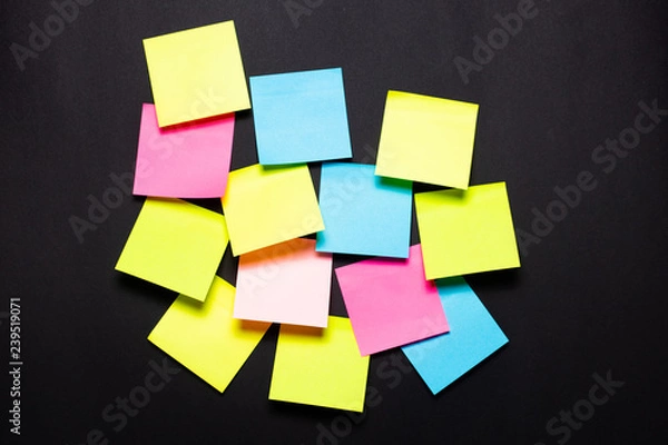 Fototapeta Many colorful sticky notes on black background