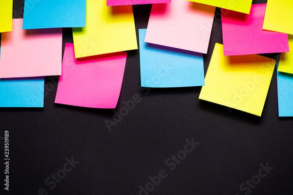 Fototapeta Many colorful sticky notes on black background