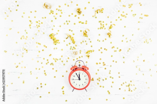 Fototapeta New Year composition alarm clock golden confetti