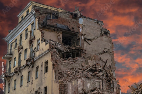 Obraz The wreckage and the skeleton of an old building destroyed to make room for modern development