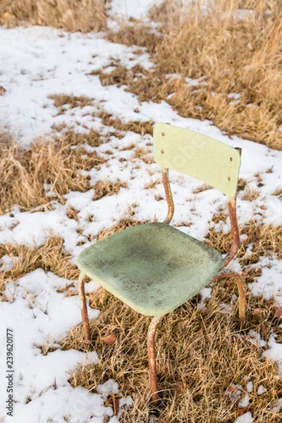 Obraz empty chair on snowy grass