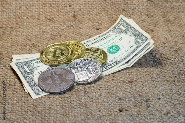 Fototapeta Coin bitcoin on the banknote dollar