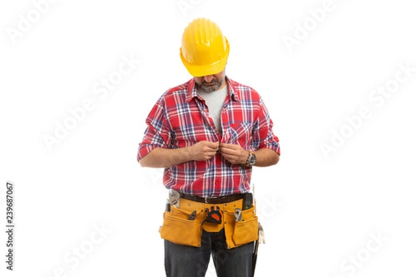 Obraz Constructor looking as buttoning shirt.