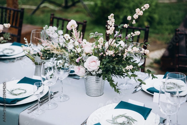 Fototapeta Wedding table decoration in rustic style. Wedding flowers.