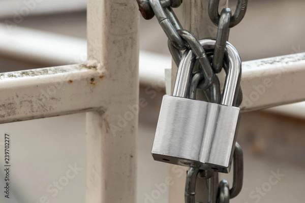 Fototapeta Padlock and chain on a gate