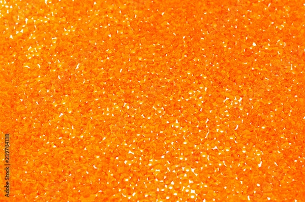 Fototapeta Flame-orange glass beads background - closeup beads texture