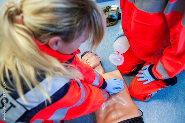 Obraz German paramedic trains emergency basics on a puppet