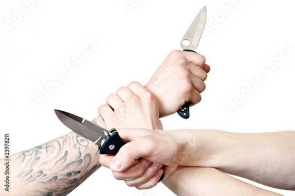 Obraz Hands holding knifes, knife fighting.