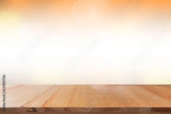 Obraz Empty desk with blurred light orange gradient bokeh abstract background