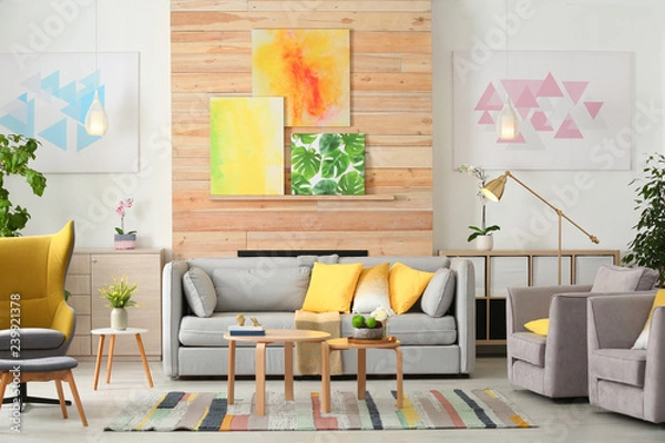 Fototapeta Stylish living room interior with comfortable couch and decorative elements