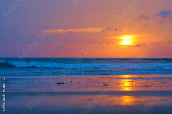 Fototapeta Spectacular sunset on the tropical ocean beach.