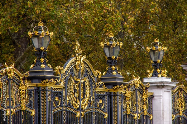 Obraz Close up view of golden details on black fence. London, England.