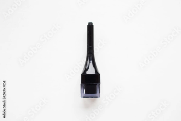 Fototapeta Close-up of black make-up product isolated on white.