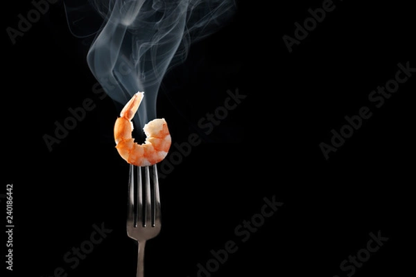 Fototapeta shrimp on fork isolated black background