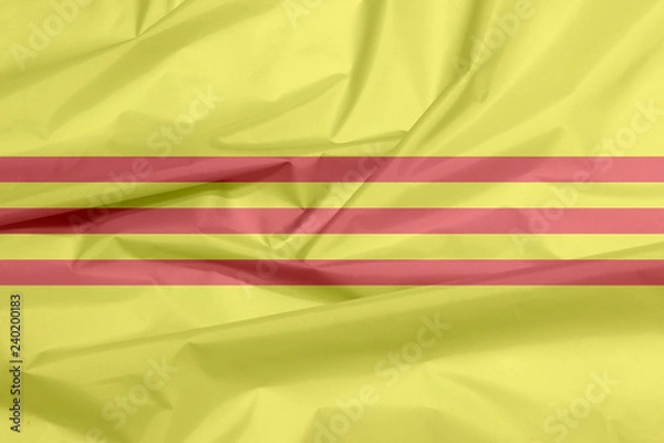 Fototapeta Fabric flag of South Vietnam or Republic of Vietnam. Crease of Heritage and Freedom flag background,  yellow with three red stripes.