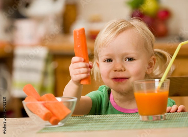 Fototapeta little girl with carrot juice