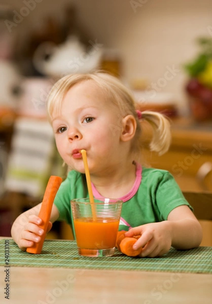 Fototapeta little girl with carrot juice