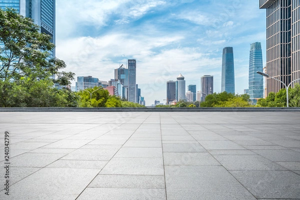 Fototapeta Panoramic skyline and modern business office buildings with empty road,empty concrete square floor