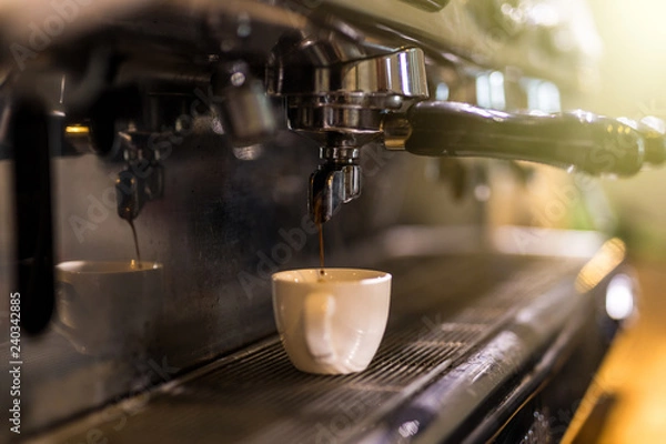 Fototapeta Coffee extraction from professional coffee machine. Coffee shop.