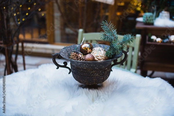 Fototapeta Wooden christmas trees and candle in Scandinavian style, vintage shutters on background. Rustic xmas decoration