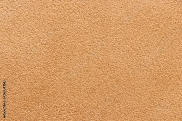 Fototapeta The texture of genuine leather beige colour. Material of animal origin. Close-up.