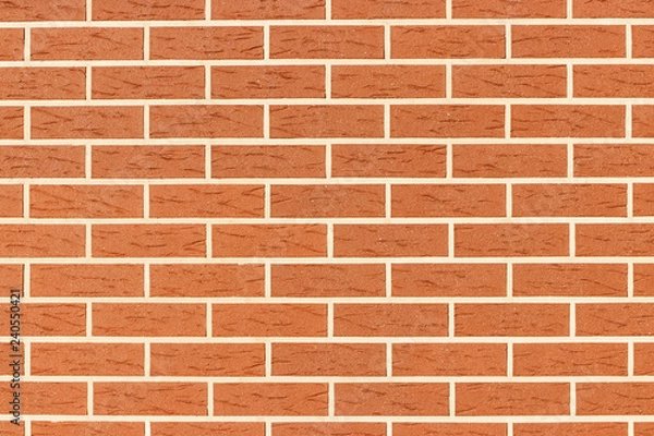 Fototapeta Wall of brown brick. The texture of the brickwork. Grunge background with space for text or image.