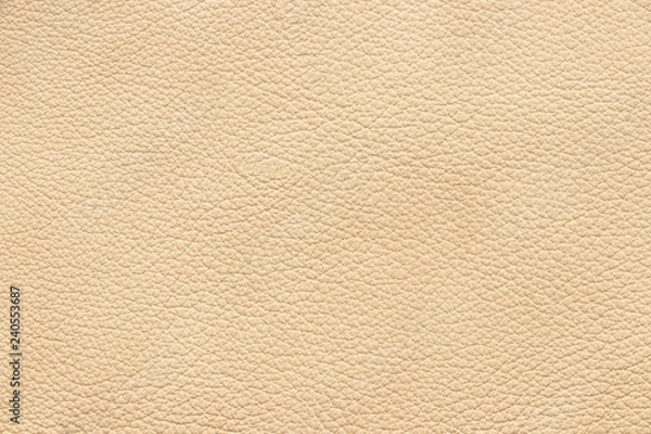 Fototapeta The texture of genuine leather beige colour. Material of animal origin. Close-up.