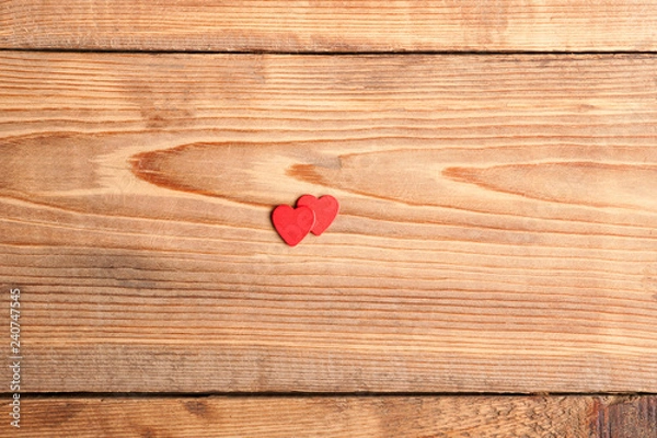 Obraz Pair of red hearts on vintage wooden table top view. Saint Valentines day greeting card.