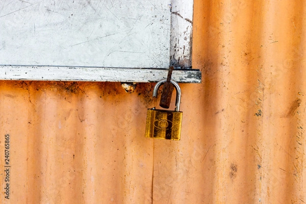 Obraz old padlock on a door