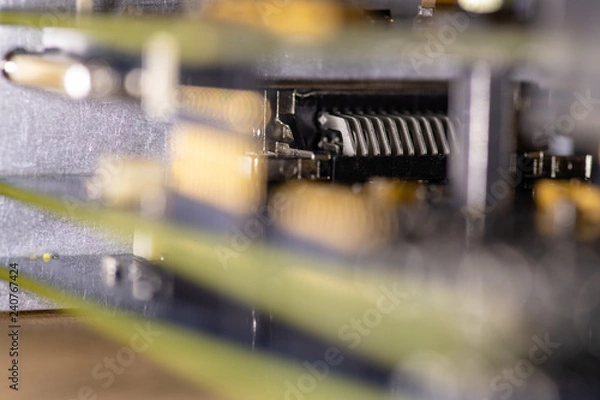 Fototapeta Close up (Macro) of Printed Circuit Board PCB embedded components (inductors, resistors, capacitors, diodes, microchips, transistor) with short depth of view.