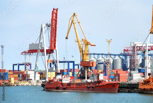 Fototapeta The trading seaport with cranes, cargoes and ship