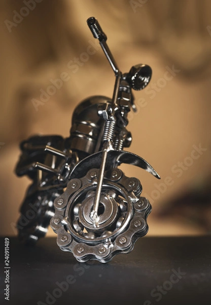 Fototapeta Close up (Macro) of Handmade metal toy motorcycle/motorbike made out of scrap metal pieces with short depth of view