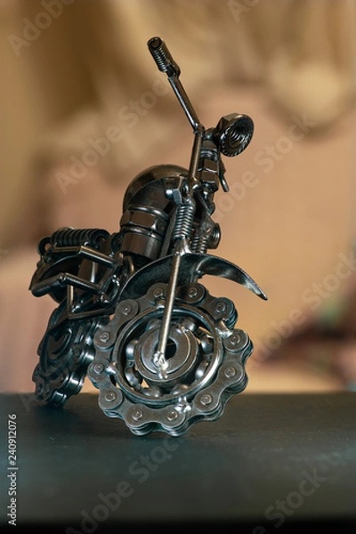 Fototapeta Close up (Macro) of Handmade metal toy motorcycle/motorbike made out of scrap metal pieces with short depth of view