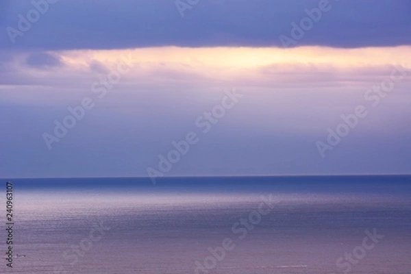 Fototapeta Reflection on the surface of the sea at dawn