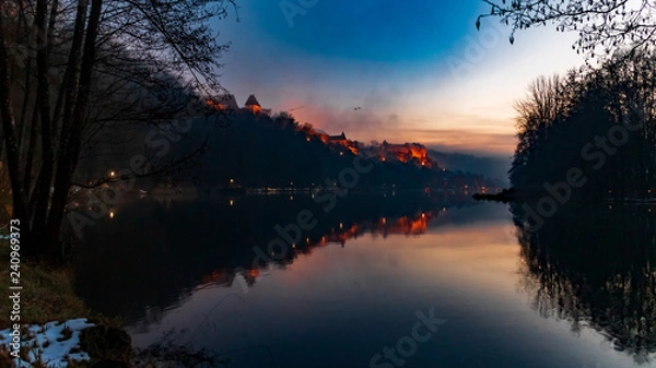 Fototapeta Beautiful sunset with reflections and the longest fortress in the world at Burghausen-Bavaria-Germany