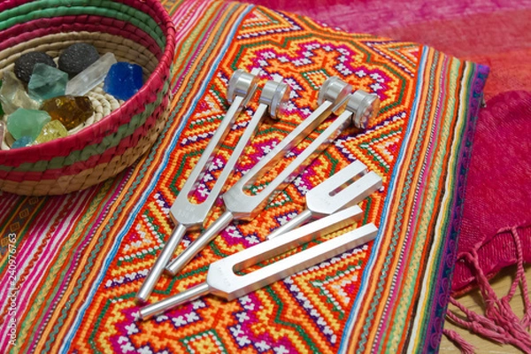 Obraz Hand holding a tuning fork .