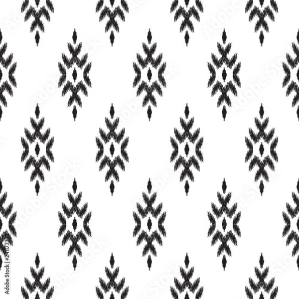Obraz Ethnic seamless pattern. Boho ikat ornament. Can be used for textile, wallpaper, wrapping paper, greeting card background, phone case print. Black and white vector illustration. Tribal graphic design.