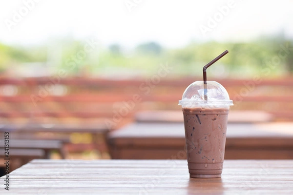 Fototapeta Iced chocolate milkshake, Summer refreshment drinks on wooden background in cafe