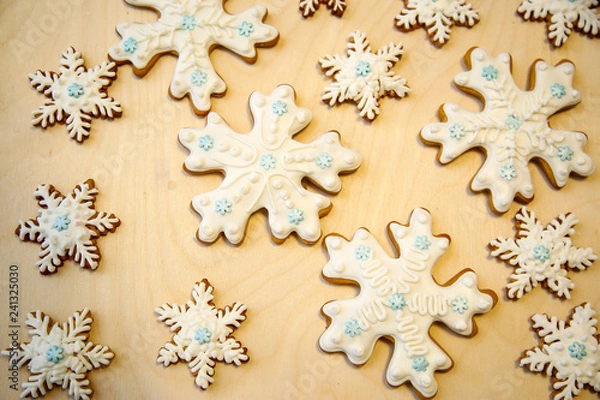 Obraz Cookies with icing. Christmas cookies in the shape of snowflakes.