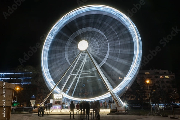 Fototapeta Christmas ferris wheel  at Moravian square at advent time on December in  Brno
