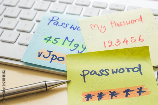 Obraz Online password management with keyborard, notes, pen.