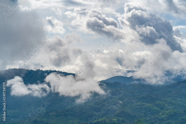 Obraz The mountains that are covered with clouds and fog