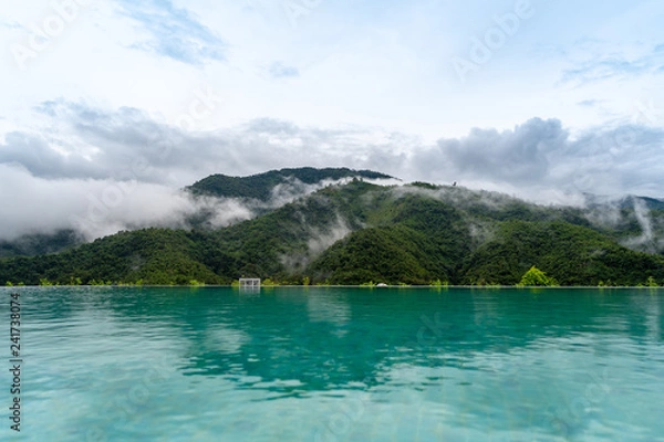 Obraz Reflections of mountains and fog at the pool