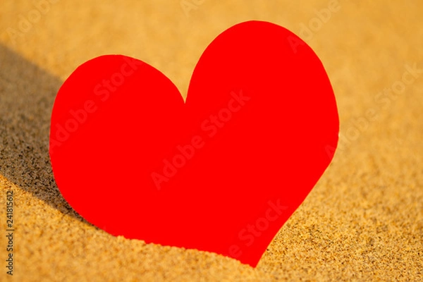 Obraz Red heart on white sand beach copyspace woman at sunset by the ocean.happy valentine's day and mother's day copy space