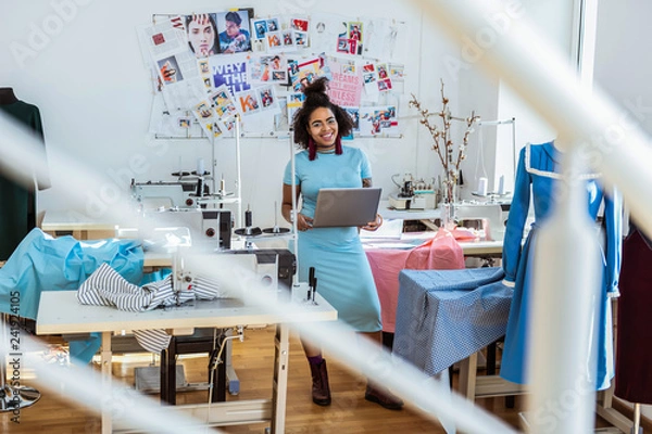 Fototapeta Smiling beaming lady spending working day on small manufactory