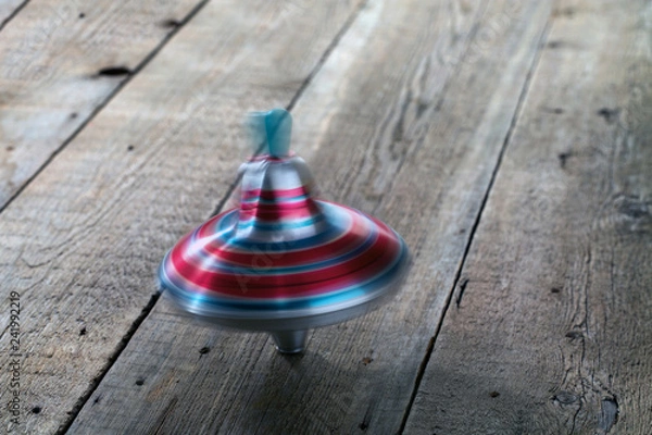 Obraz Yule toy spins on wooden floor