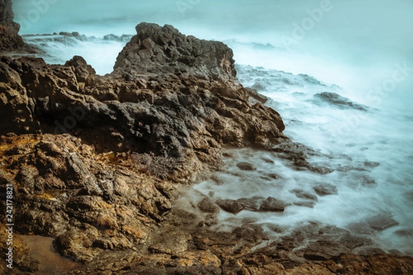 Fototapeta waves long exposure hitting coast