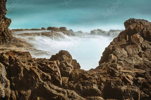 Fototapeta waves long exposure hitting coast