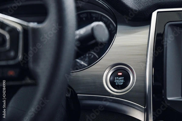 Fototapeta Engine Start Stop button of a modern car. The interior of the expensive car